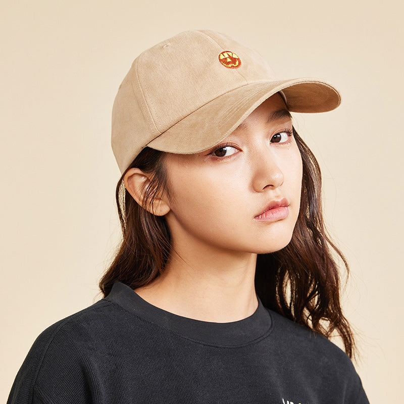 woman wearing a brown anta cap